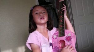 five year old (colina) playing guitar and singing "Twinkle, Twinkle, Little Star"