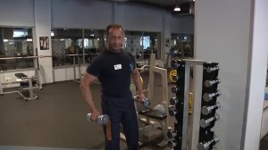 Подъем гантелей в стороны.  Олег Кулаков