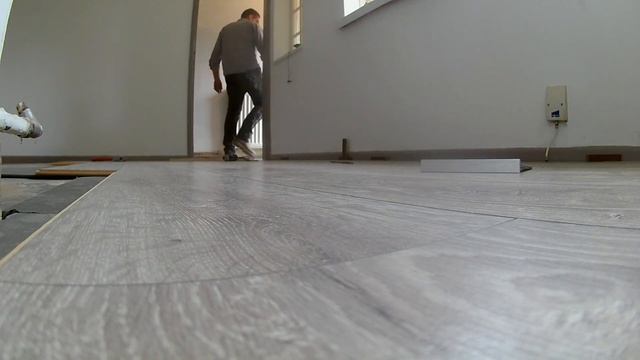 Laying Laminate Flooring In The Living Room and Hall Way