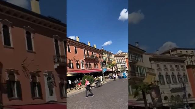 Old clock of the medieval Porta Nuova, gate to the old town of Verona. Piazza Bra in Verona, Italy