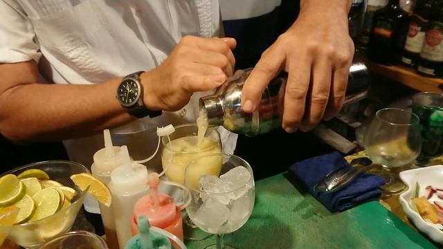 Бармен Alejandro makes a cocktail Hotel Memories Flamenco Beach Resort Cayo Coco Cuba 2023