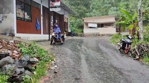 Heavy rain all day in a beautiful village, water floods the roads, walking in the rain for sleeping