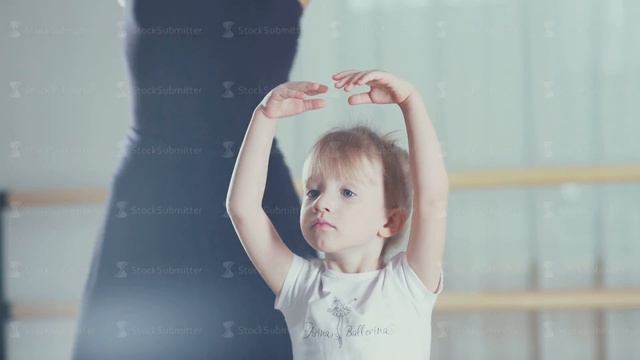 Girl raises arms in the third position. Children's ballet school смотреть онлайн