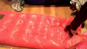 Girl poping air mattress in high heels