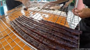 Argentinian Grill Master Roasts Huge Blocks of Bull Meat. Italy Street Food Festival