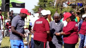 58 Year old Priscila Biwott being awarded by leaders after finishing 10KM race in Kapsowar