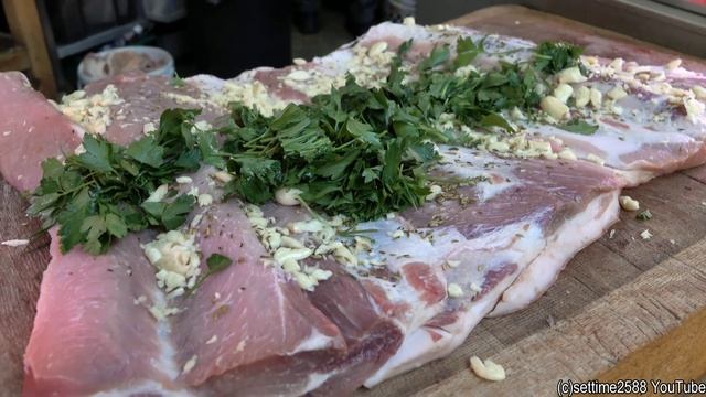 Stuffed Fat Pork Belly the Italian Way. Preparing "Porchetta". London Street Food