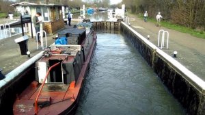 Barge across Stonebridge Lock 16 in the River Lee (Tottenham marshes) London