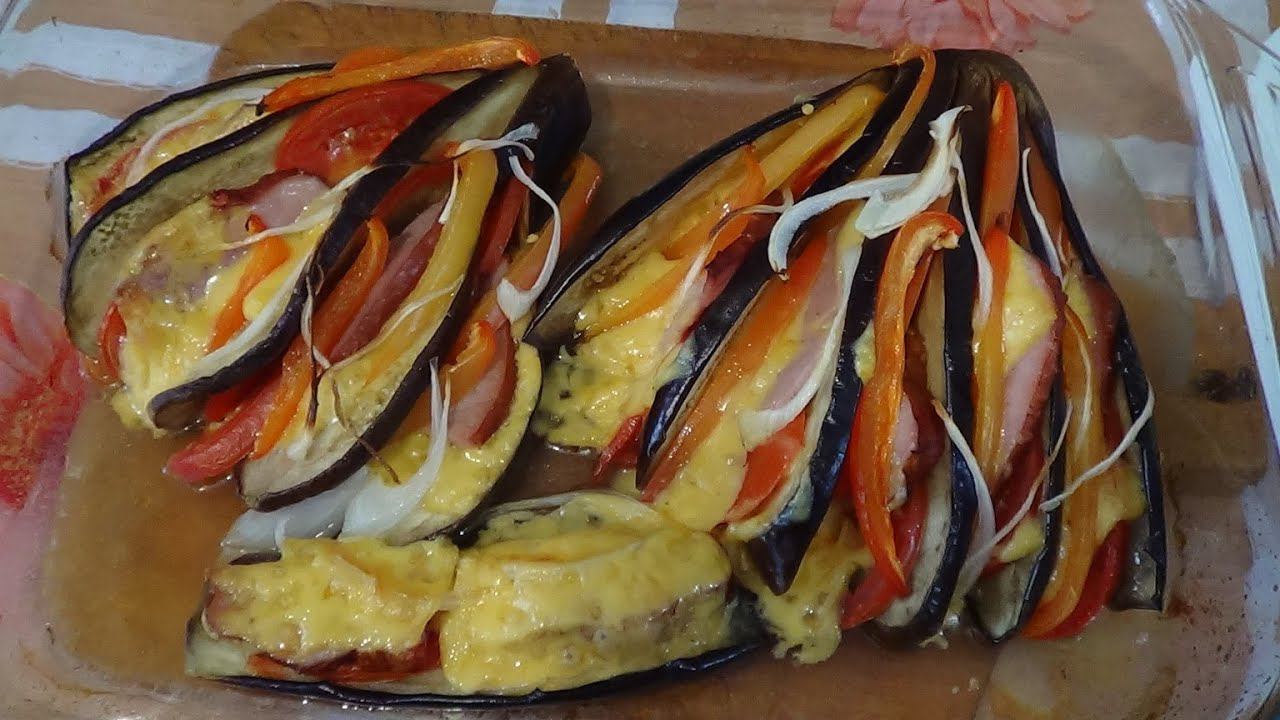 Баклажаны в духовке с помидорами сыром и ветчиной