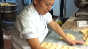 Veniero's baker making handmade tart shells.