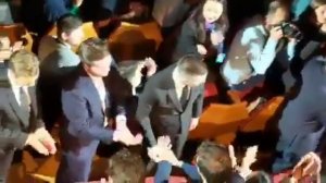 Video of Rob, Willem, Robert inside theater and audiences standing ovation after screening