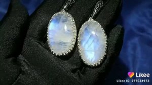 Крупные серьги с природным лунным камнем (адуляр) на серебре в фантазийном дизайне.