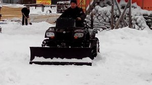 Уборка снега квадроциклом.