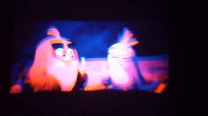 Angry Birds movie 2 red N silver swimming in the ocean behind lava