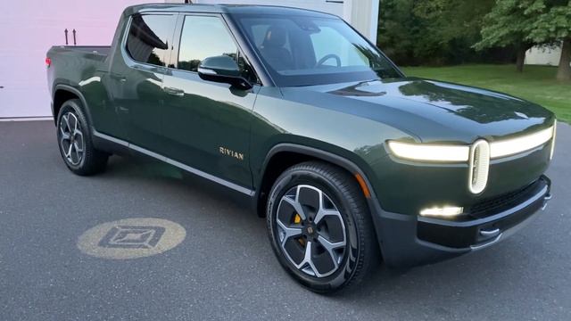 Rivian car open with key fob and down lighting from side mirrors смотреть онлайн