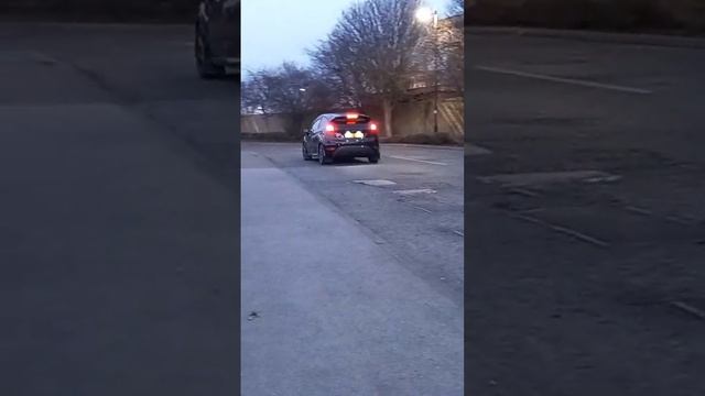 A loud Black Fiesta Zetec S entering carmeet with some cool mudflaps