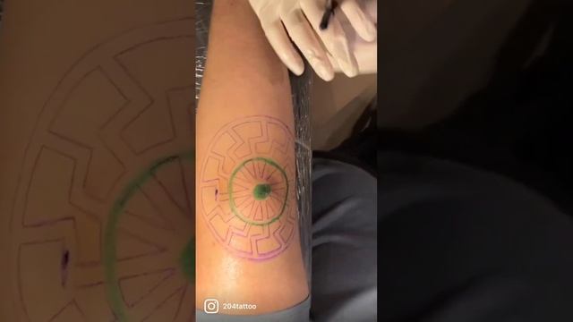 Black sun tattoo