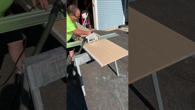 Utilizing the Festool track saw to cut laminate counter top.