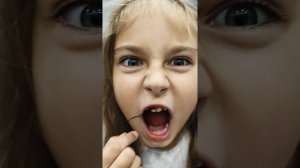Как вырвать молочный зуб!?