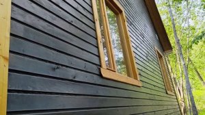 Вагонка каркасного дома, покрытая фасадным маслом.