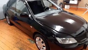 Установка лобового стекла на Mitsubishi Lancer 9