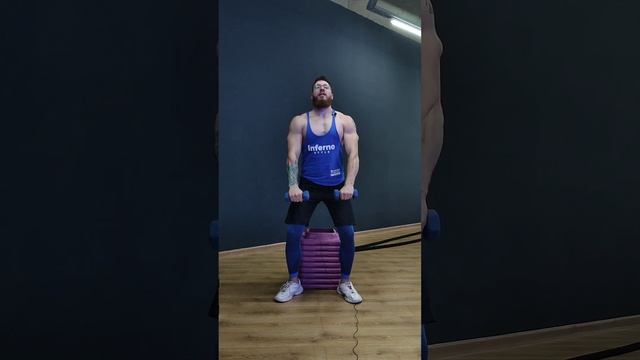 Приседания на опору + махи гантелями перед собой.
