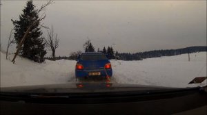 AUDI A6 pulling Subaru Impreza WRX Sti out of snow