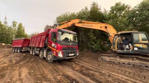 VOLVO FMX 420 впечатляющий процесс по вызволению застрявшего самосвала с прицепом груз 40 м3 грунта